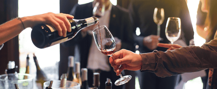 a glass of wine being poured